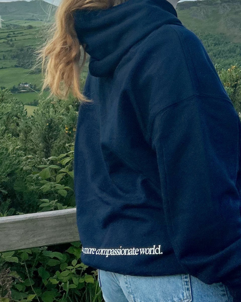 A More Compassionate World Oversized Hoodie Oversized Hoodie Compassion Threads Sustainable vegan clothing premium ethical cruelty-free fashion
