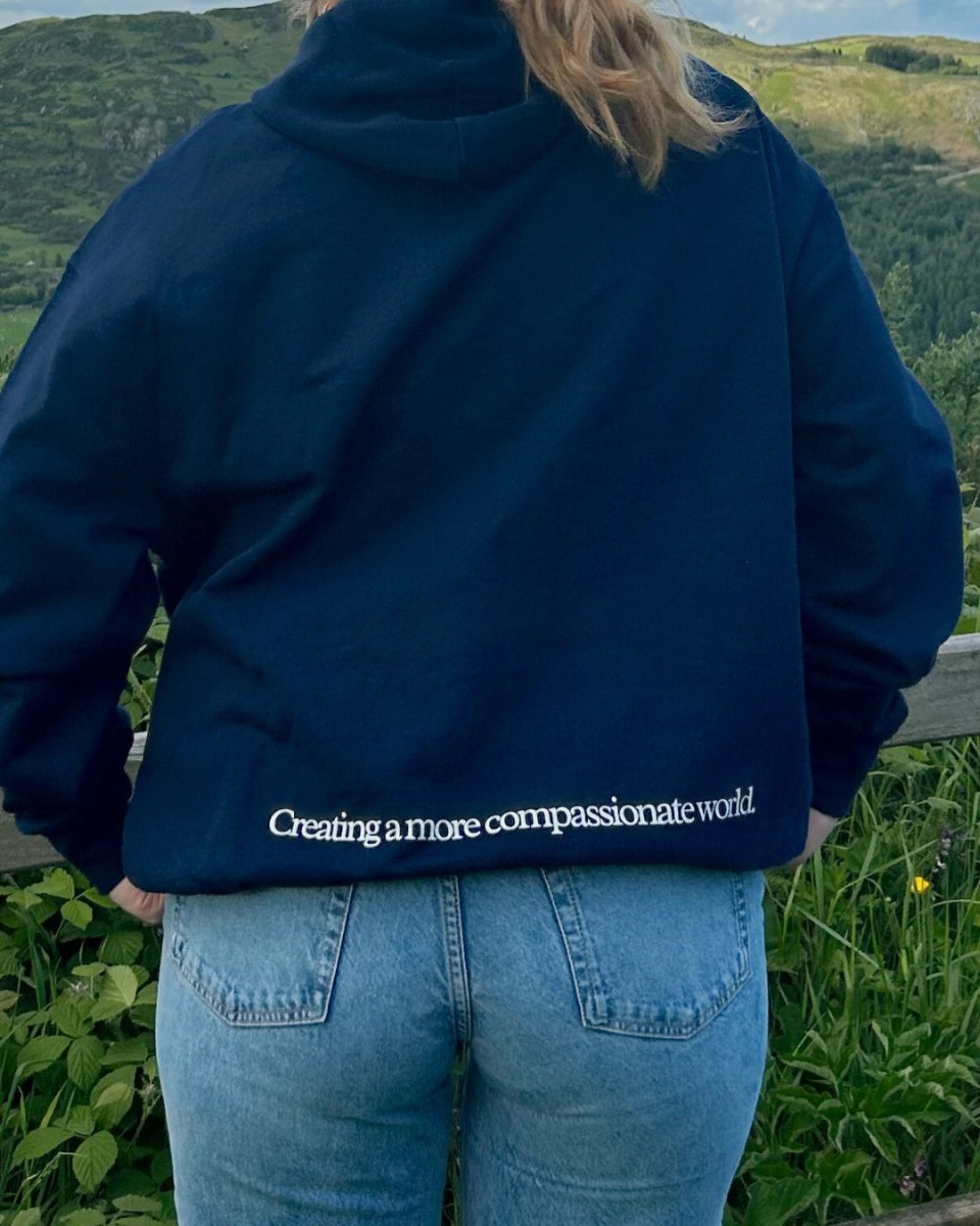 A More Compassionate World Oversized Hoodie Oversized Hoodie Compassion Threads Sustainable vegan clothing premium ethical cruelty-free fashion